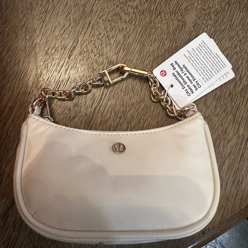 Lululemon Athletica Cream Wristlet with Gold Chain